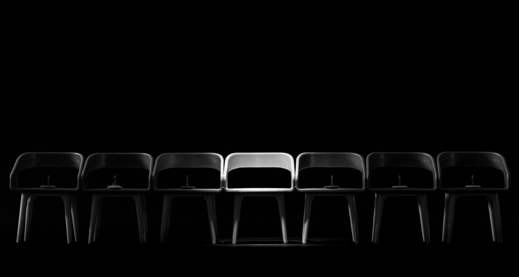 Chairs lined up in a dark room